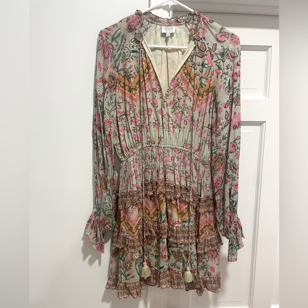 Gently used dress, love the silver strands running through it.